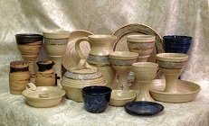 This is a photo of the complete line of stoneware communionware from communionware.com photo of all of our wheel-thrown travel communion sets