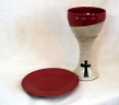 photo of red glazed chalice and paten by Ocepek Pottery