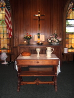 A photo of the altar display of the Spirit Congregational Communion Pottery set by Ocepek Pottery in Akron, Ohio. Photo courtesy of  Kingsley United Methodist Church, Kingsley, Mi., 
Photographer Tim Goldsmith