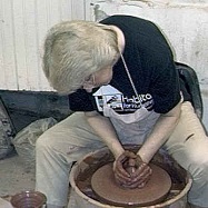 A photo of Debra Ocepek making clay chalice at the potter's wheel, Cuyahoga Falls Ohio, potter at wheel as in Jeremiah 18