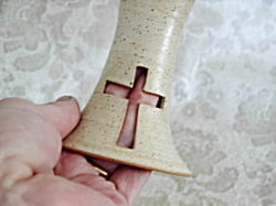 photo of carved cross in communion chalice