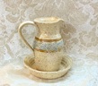 photo of stoneware communion cruet pitcher and bowl in Spirit pattern made by Debra Ocepek of Ocepek Pottery